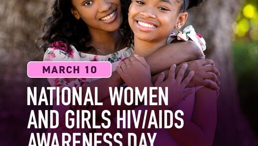 Two young women smiling and embracing each other