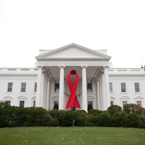 A picture of the White House with the AIDS ribbon hung outside.