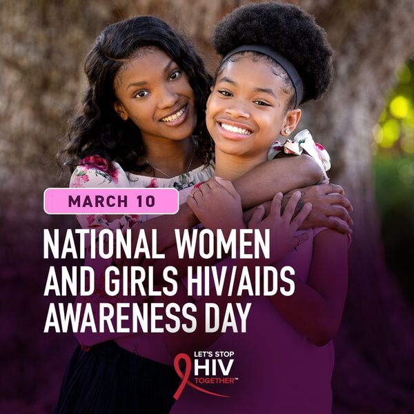 Two young women smiling and embracing each other
