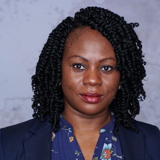 Professional headshot of Pousga